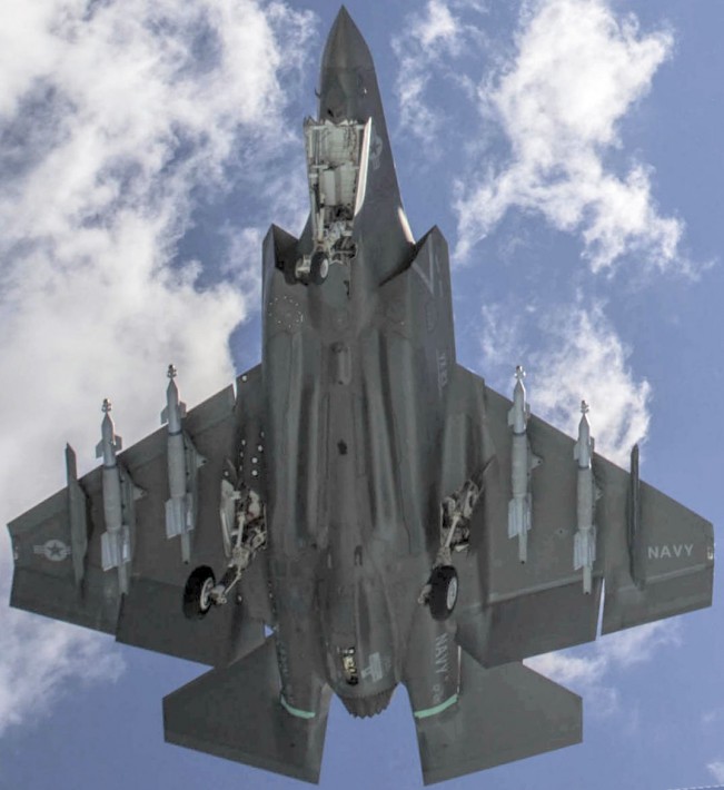 F-35Cload4bombsWingFantailUnderCVN73aug2016cropROT.jpg